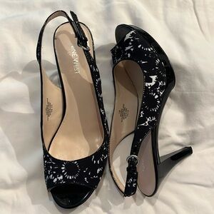 Black and white cloth and patent leather heels